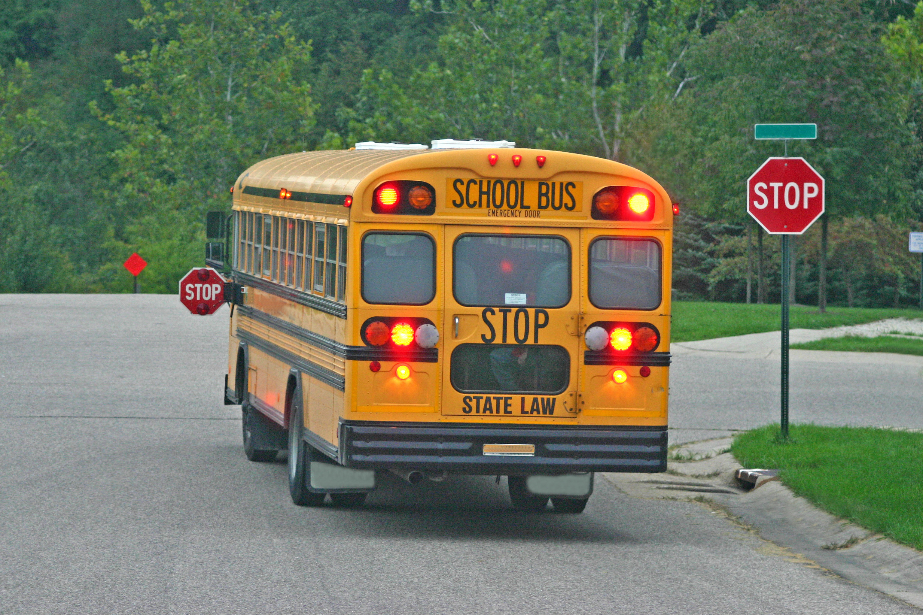 school bus at stop sign AdobeStock 1369147